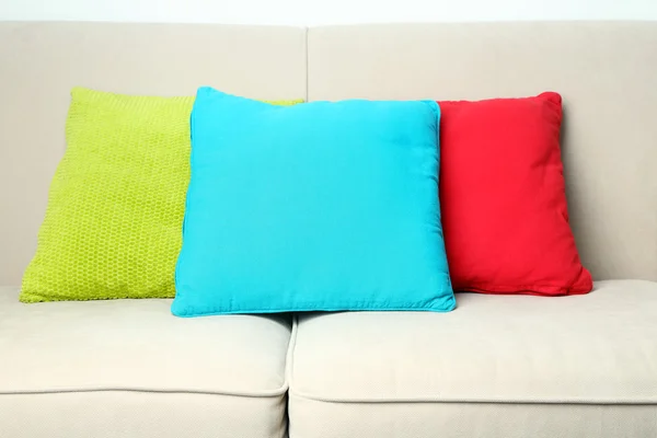 Colorful pillows on sofa — Stock Photo, Image