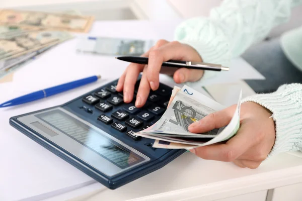 Accounting concept.Analyzing finance report with calculator — Stock Photo, Image