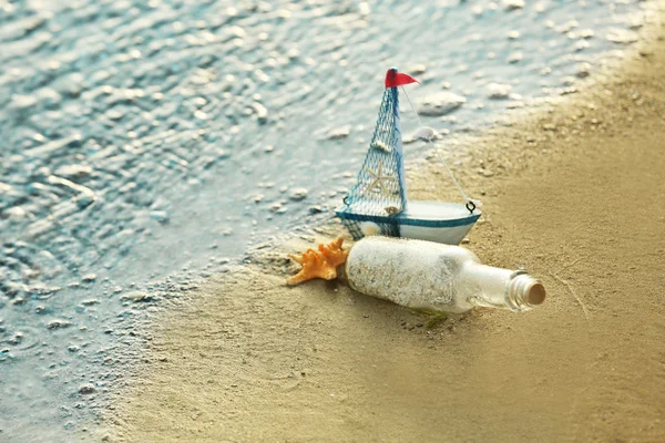 Glass bottle with sand — Stock Photo, Image