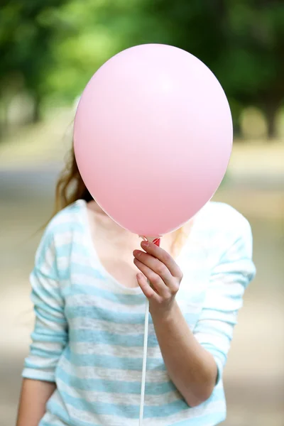 Girl holding balloon — Stock Photo, Image