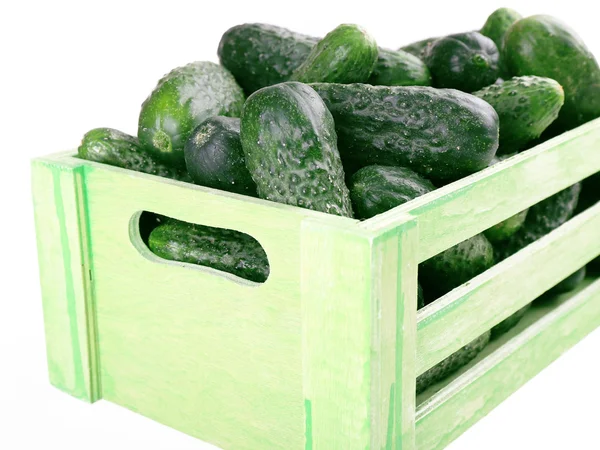 Ripe cucumbers in wooden box — Stock Photo, Image