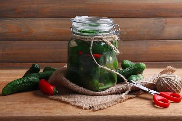 Tinned cucumbers in glass bottle — Stock Photo, Image