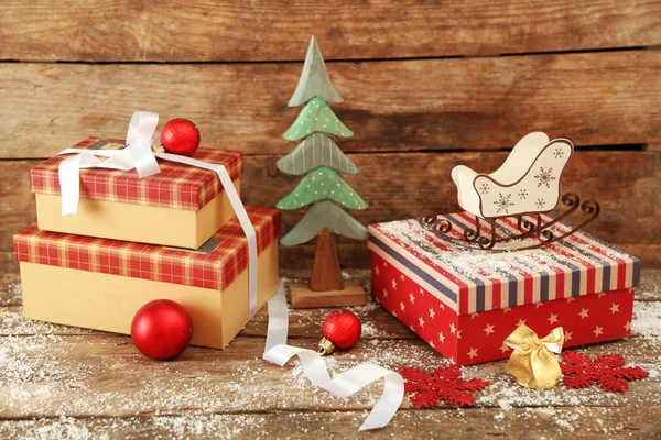 Gift boxes on wooden background — Stock Photo, Image