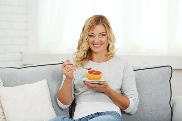 Beautiful woman with grapefruit