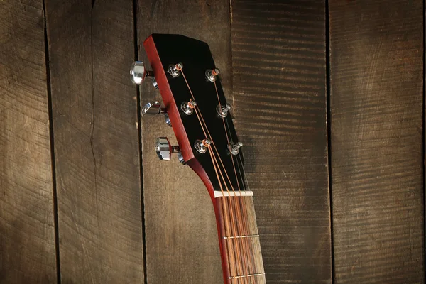 Headstock na parede de madeira fundo closeup — Fotografia de Stock