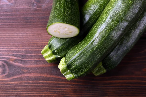 Fresh zucchini on wooden background — Stock Photo, Image