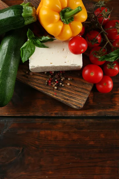 Fresh ingredients for preparing zucchini rolls on wooden background — Stock Photo, Image