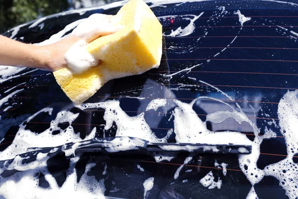 Hand washing car window — Stock Photo, Image