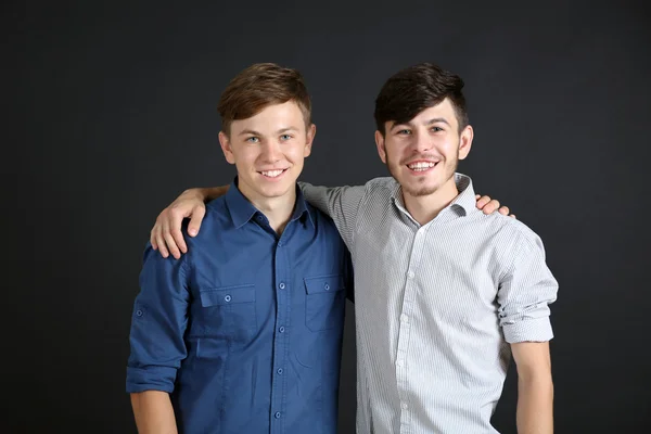 Two brothers on dark — Stock Photo, Image