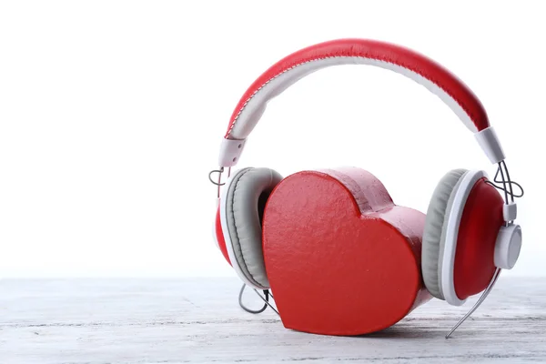 Red headphones with heart isolated on white — Stock Photo, Image