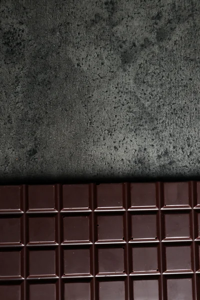 Chocolate bar on grey background — Stock Photo, Image