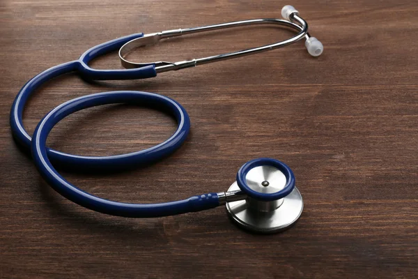 Stethoscope fából készült háttér — Stock Fotó