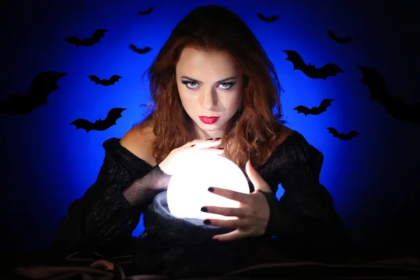 Witch on dark background with images — Stock Photo, Image