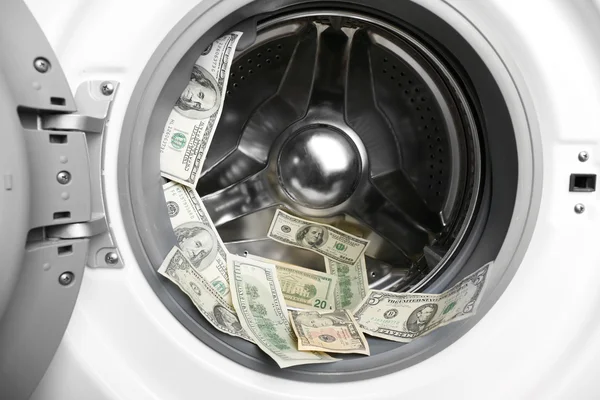 Dirty dollars in washing machine, close up — Stock Photo, Image