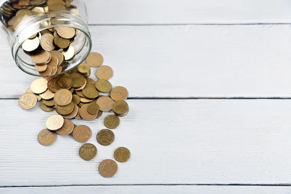 Coins in money jar — Stock Photo, Image