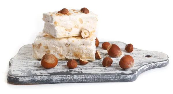 Sweet nougat with hazelnuts isolated on white — Stock Photo, Image