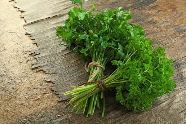 Fresh parsley on wooden background — Stock Photo, Image