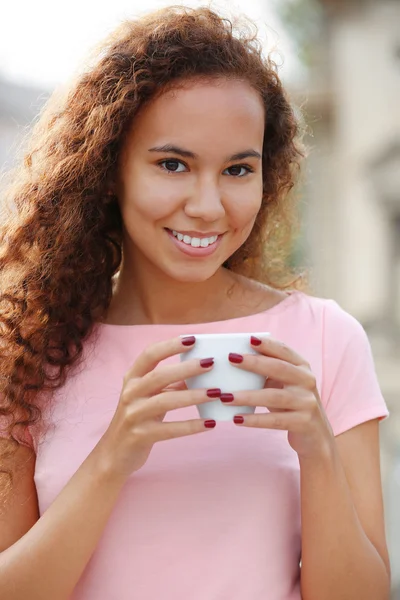 Woman drinking coffee at summer terrace — Stock Photo, Image