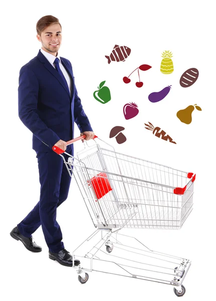 Young man pushing shopping cart — Stock Photo, Image