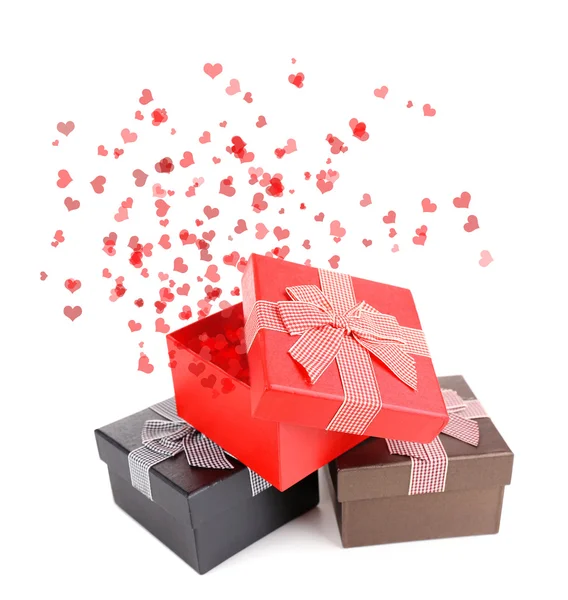 Gift boxes and small red hearts — Stock Photo, Image