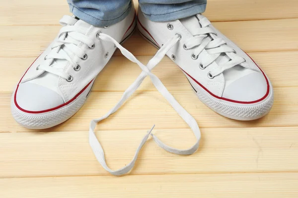 Pés em sapatos de goma — Fotografia de Stock