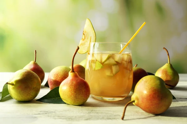 Fresh pear juice with fruit on bright background — Stock Photo, Image