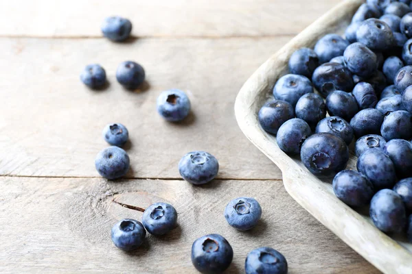 Tasty ripe blueberries on wooden table close up — Stock Photo, Image