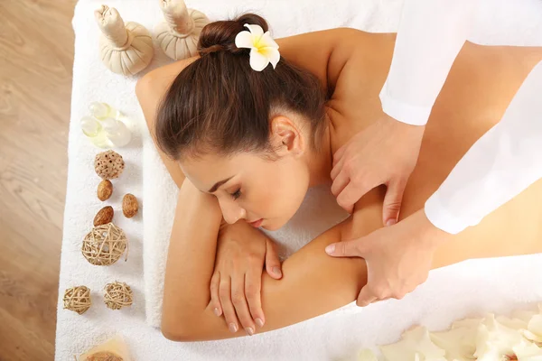 Young woman on massage table — Stock Photo, Image