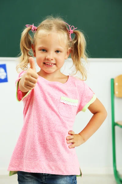 Lovely girl in classroom — Stock Photo, Image