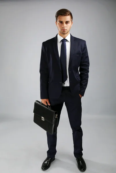 Elegant man in suit with briefcase — Stock Photo, Image