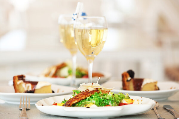 Tasty salad with served wine