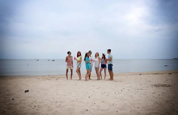 Beautiful people having fun on beach — Stock Photo, Image