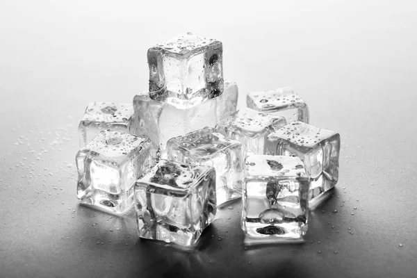 Perfect clear ice cubes on grey background — Stock Photo, Image