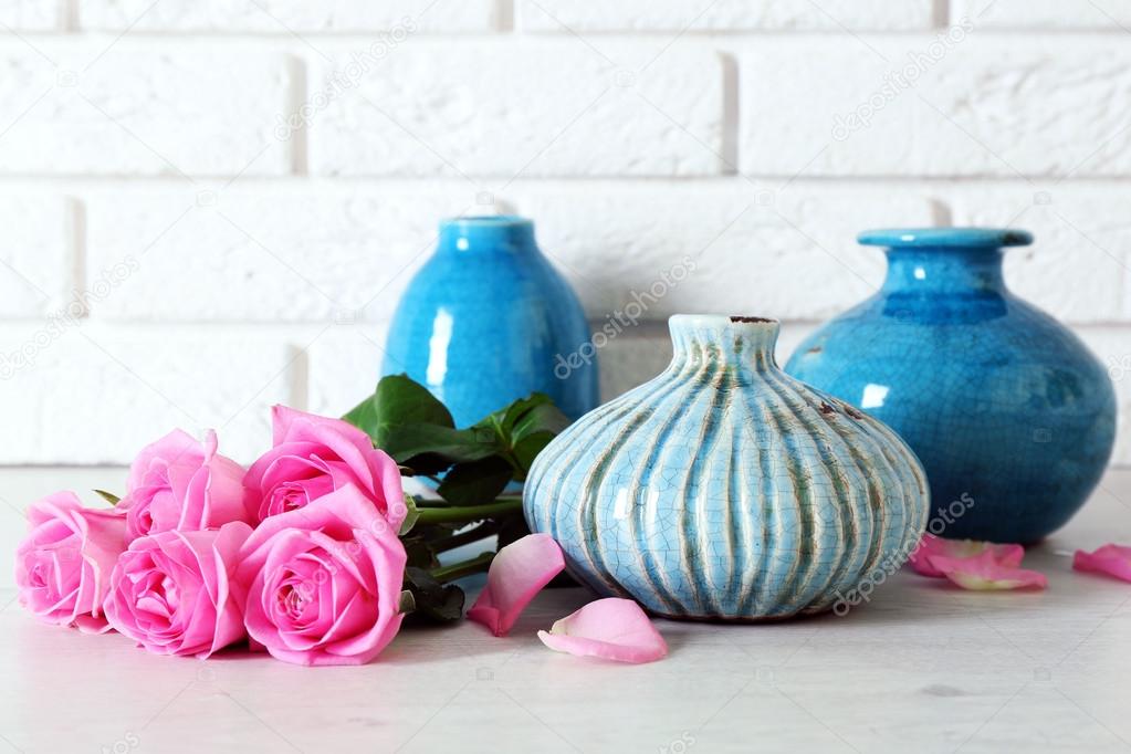 Beautiful roses and vases