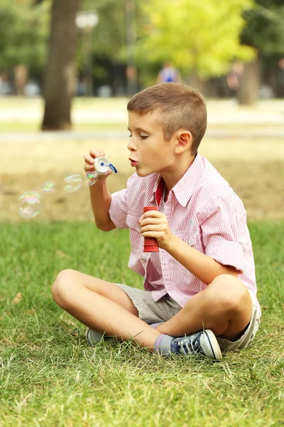 Little boy playing with bubbles — Stock Photo, Image