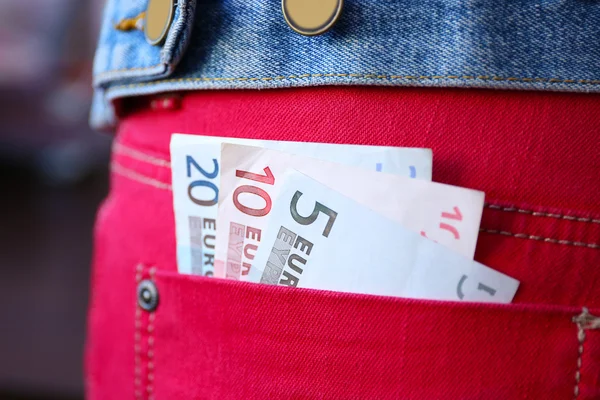 Banconote in euro in jeans — Foto Stock