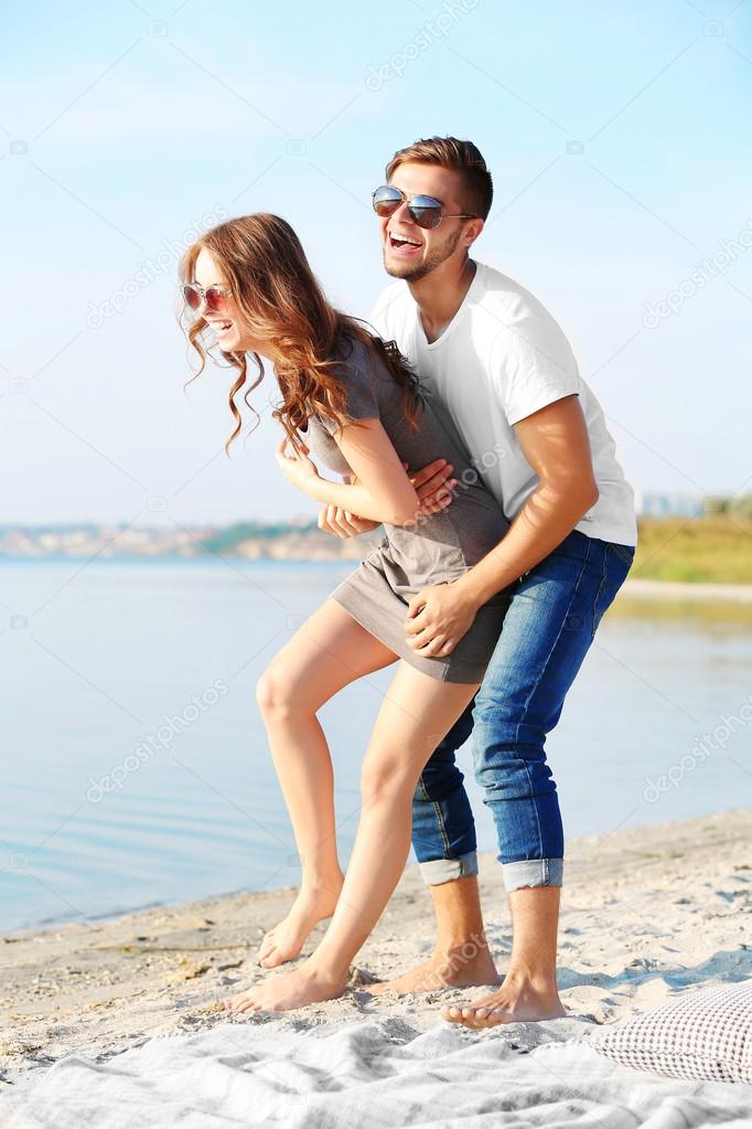 Young couple on the riverside