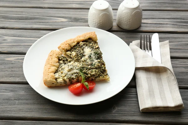 Slices of open pie with spinach and tomato cherry on table close up — Stock Photo, Image