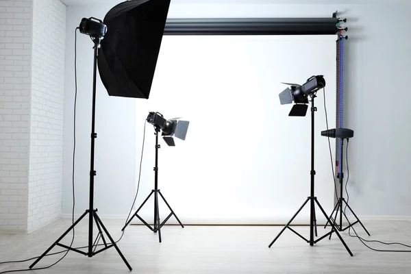 Photo studio with lighting equipment Stock Photo by belchonock