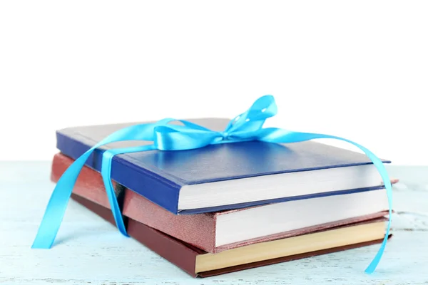 Stack of books with ribbon — Stock Photo, Image