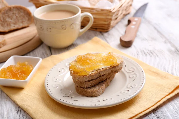 Fresh toast with butter and jam on table close up — Stock Photo, Image