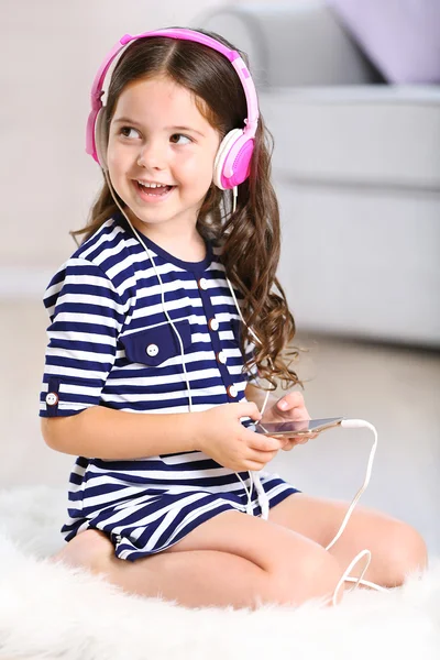 Little girl in striped dress — Stock Photo, Image