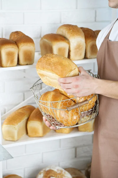 Baker holding freshly baked bread — Stock Photo, Image