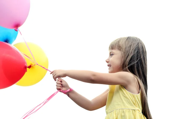 Liten flicka med ballonger — Stockfoto