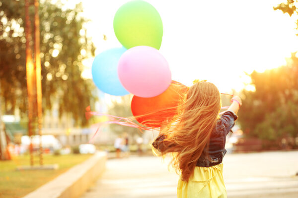 Little girl with balloons  