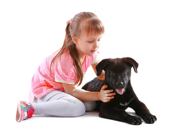 Roztomilá holčička s štěně — Stock fotografie