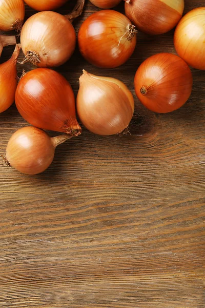 Onion on wooden background — Stock Photo, Image