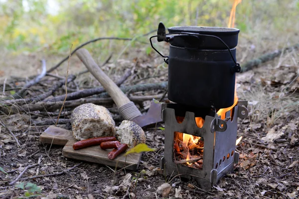 Kettle on fire in forest