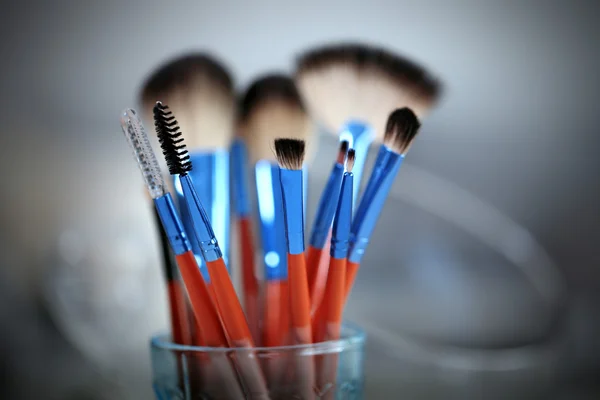 Cosmetic brushes in glass — Stock Photo, Image