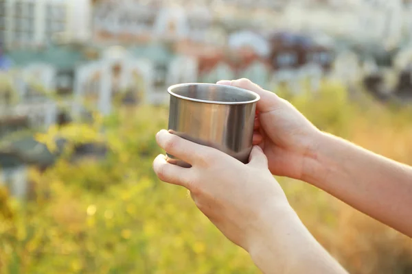 Tea cup in female hands — Stock Photo, Image